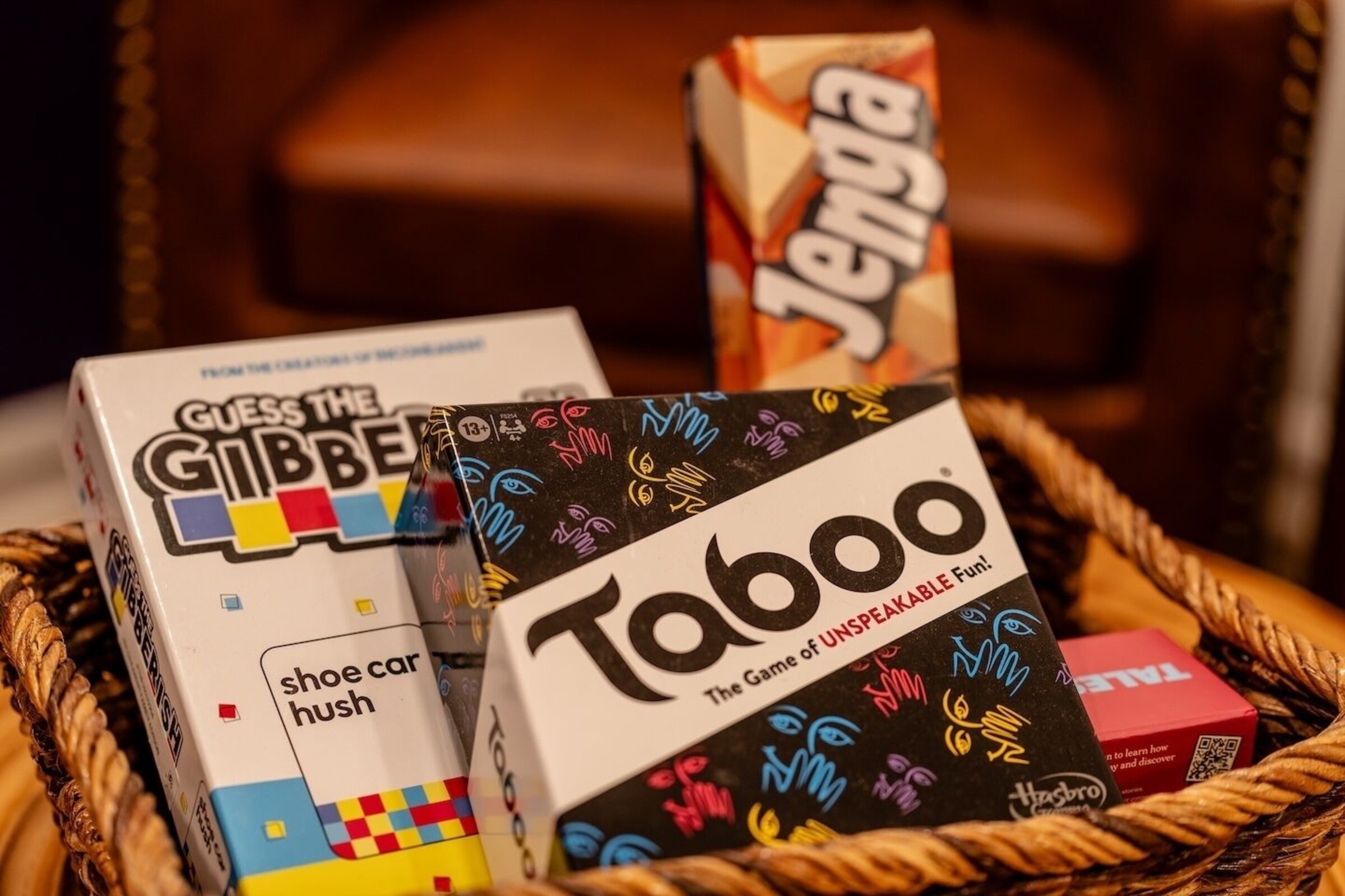 Basket of board and card games for guests to use