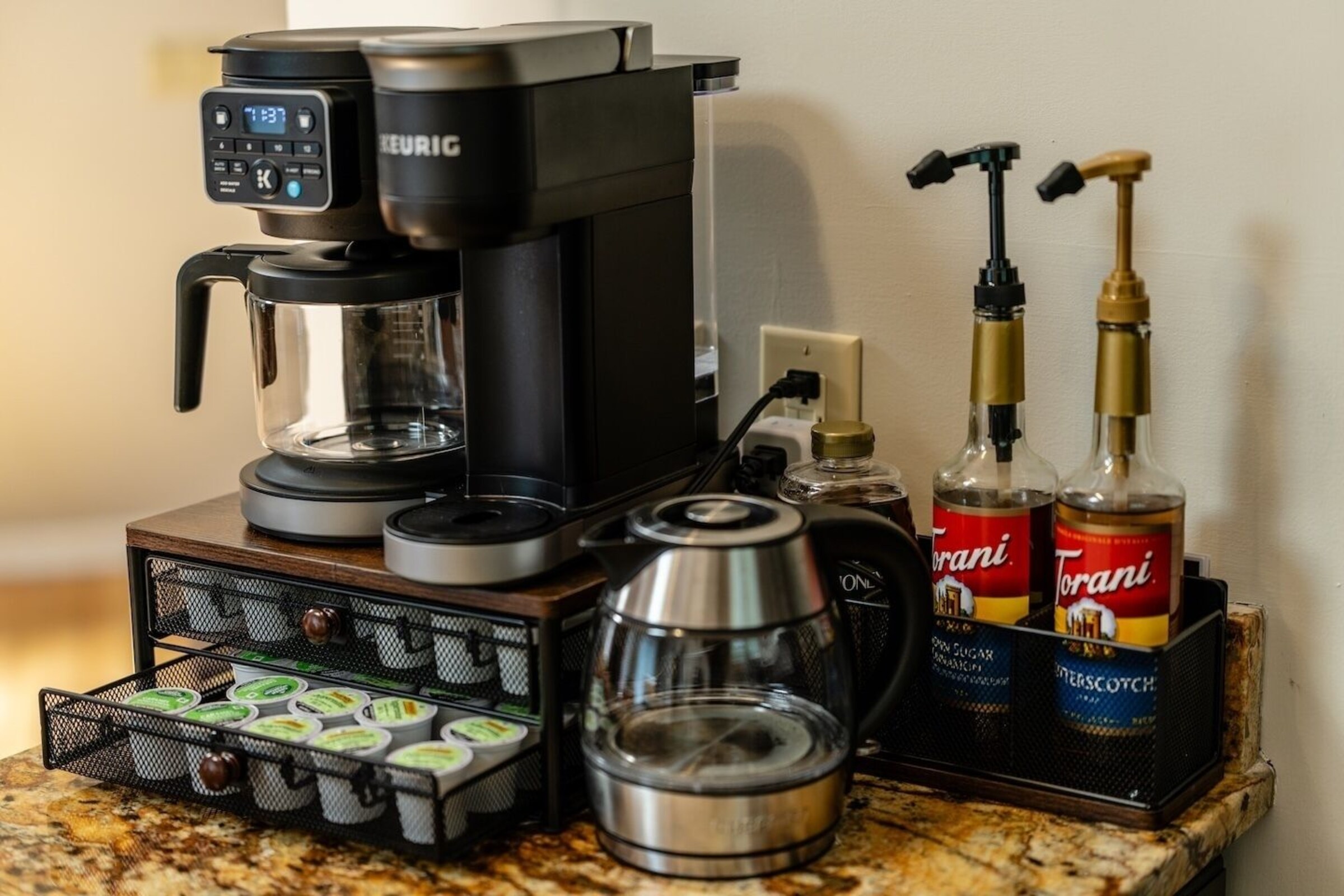Coffee bar with Keurig, kettle and flavored syrups