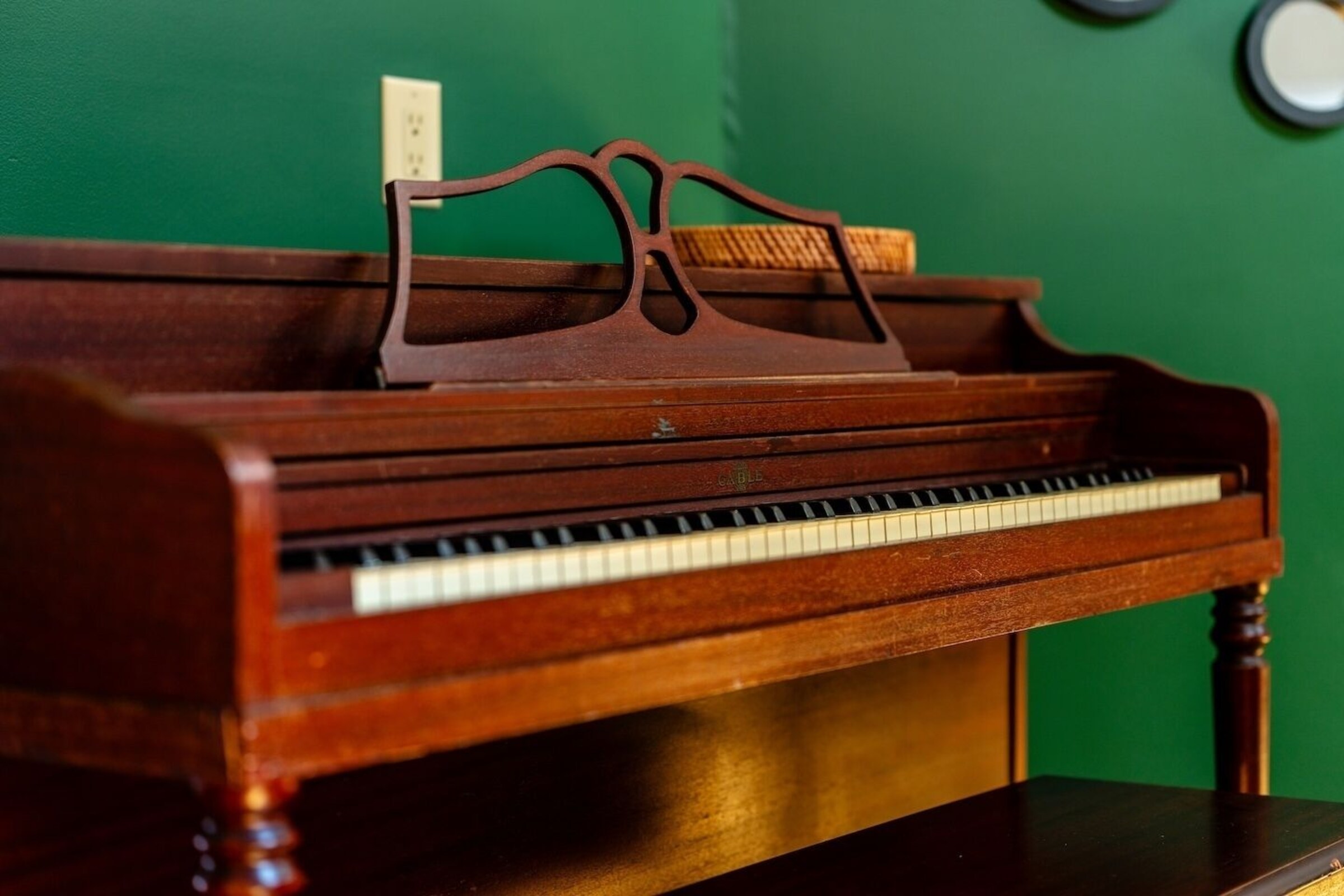 Antique upright piano in the living room