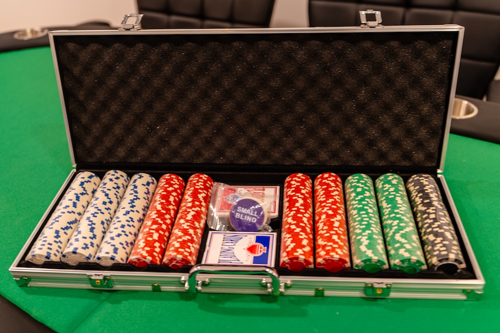 Poker chip set with cards in the poker room